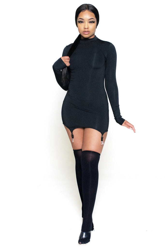 dress. Featuring garter straps and matching stockings. The garter straps attach to the stockings. The dress features long sleeves and a mock neck. 
