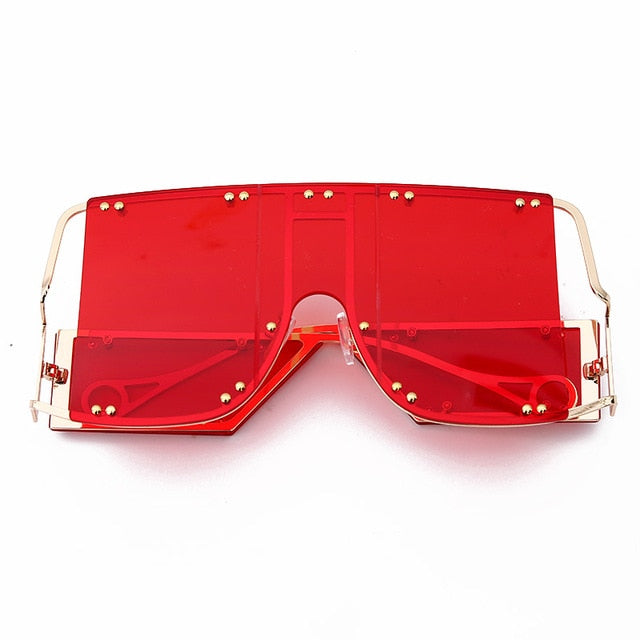 red  color pop shades. Featuring an gold frame oversized square design trimmed in gold.  Theses special sunglasses change colors in different lighting. 