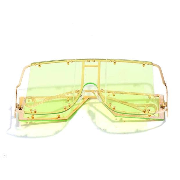 light green color pop shades. Featuring an gold frame oversized square design trimmed in gold.  Theses special sunglasses change colors in different lighting. 