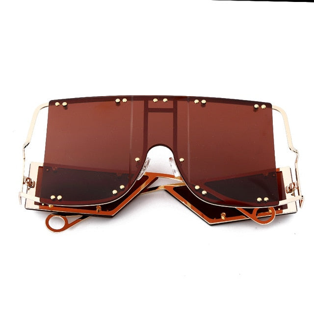 rust color pop shades. Featuring an gold frame oversized square design trimmed in gold.  Theses special sunglasses change colors in different lighting. 