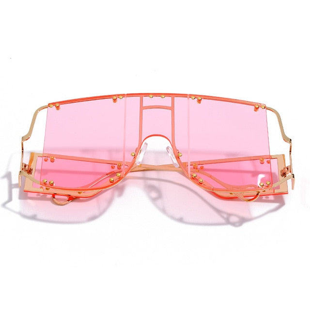 rose color pop shades. Featuring an gold frame oversized square design trimmed in gold.  Theses special sunglasses change colors in different lighting. 
