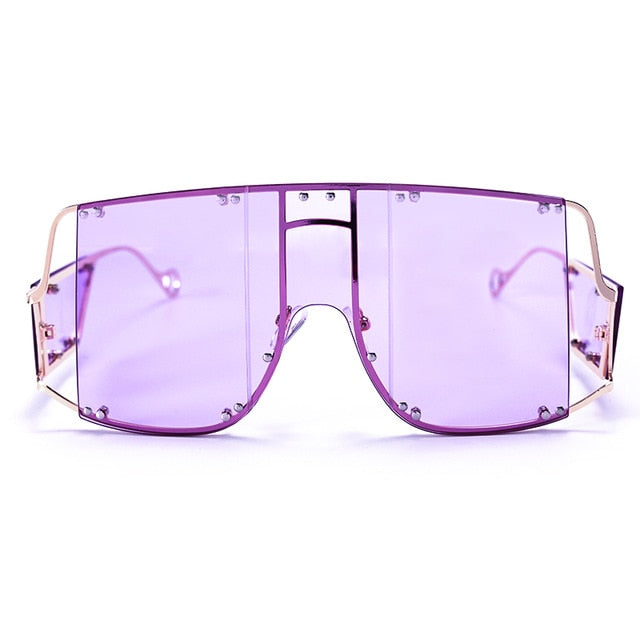 purple  color pop shades. Featuring an gold frame oversized square design trimmed in gold.  Theses special sunglasses change colors in different lighting. 