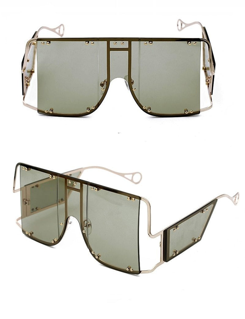 dark gray color pop shades. Featuring an gold frame oversized square design trimmed in gold.  Theses special sunglasses change colors in different lighting. 